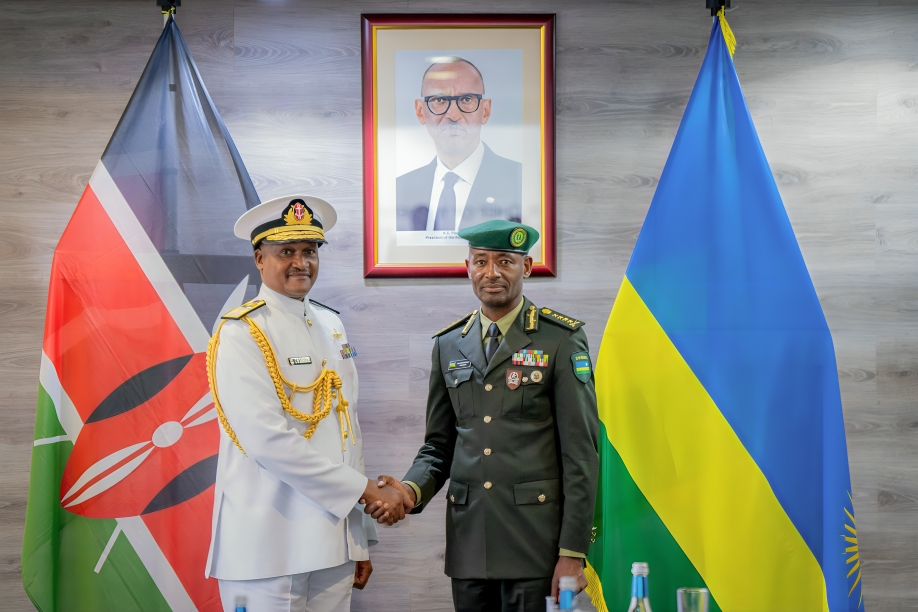 Lt Gen Mubarakh Muganga of Rwanda shakes hands with Gen Charles Muriu Kahariri of Kenya