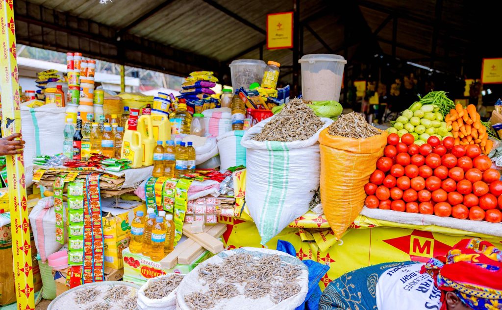 Tomatoes and other goods in a local market. Courtesy Photo