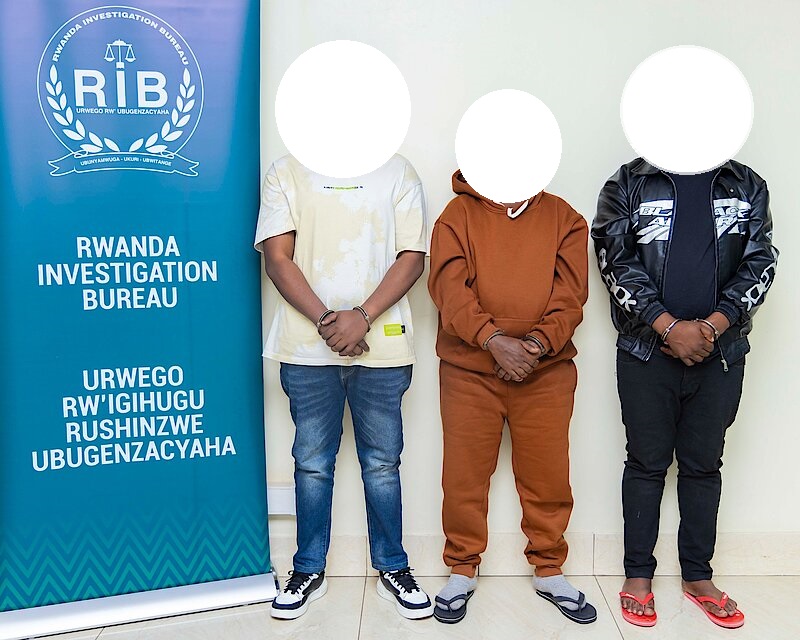 Covered image of three suspects at a RIB station. Photo by Rwanda Investigation Bureau