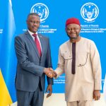 Ambassador Charles Karamba and Mr. Ozonnia Ojielo shake hands during an official courtesy meeting.